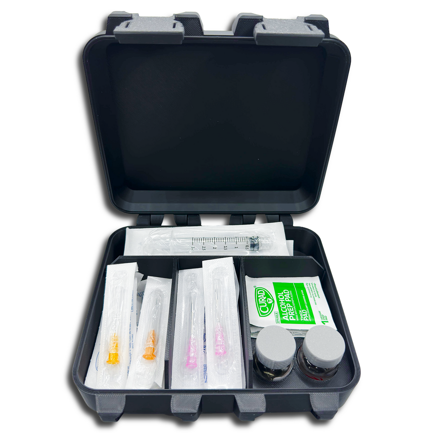 Open HRT supply case front view showing organized storage for vials, disposable needles, alcohol prep pads, and syringes.