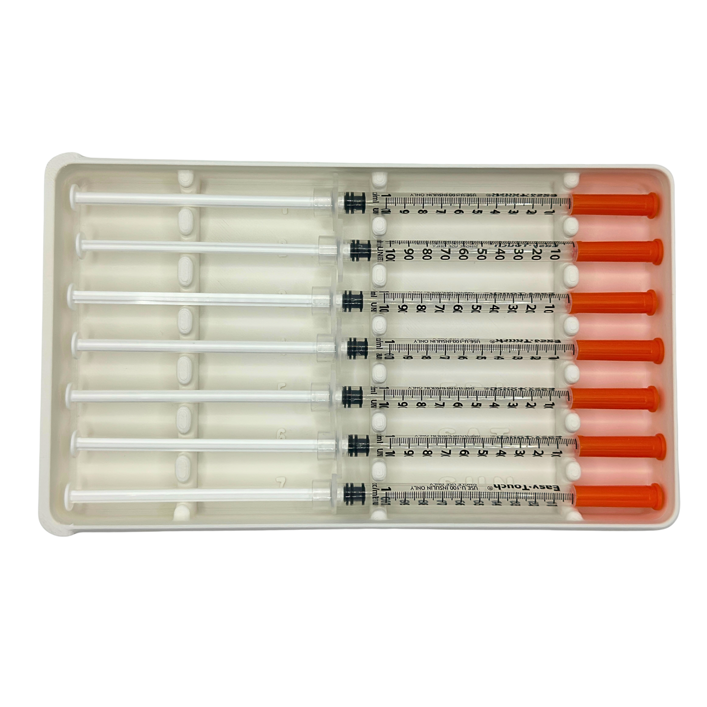 Weekly prefilled syringe organizer in white, top-down view holding seven 1ml insulin syringes with orange caps. All 7 numbered slots visible with day-of-week labels and raised dividers for syringe separation. Syringe storage case for weekly dose prep, fridge organization, or travel.