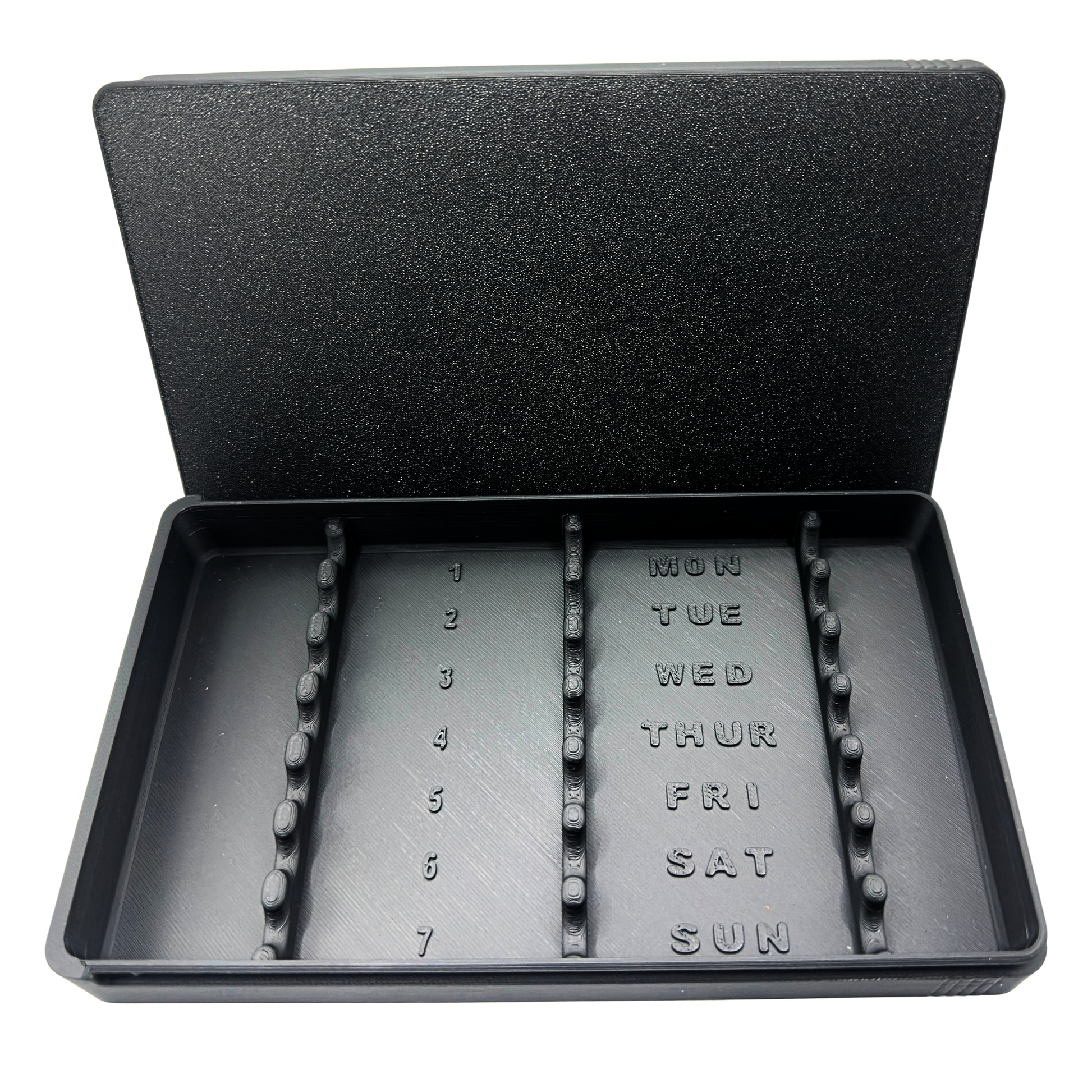 7-slot weekly syringe organizer case shown empty to display interior layout. Numbered slots 1 through 7 with day-of-week labels Monday through Sunday and raised dividers for syringe separation. Black prefilled syringe storage case with sliding lid designed for 1ml insulin syringes up to 180mm long. Ideal for TRT, GLP-1, HRT, or peptide routines.
