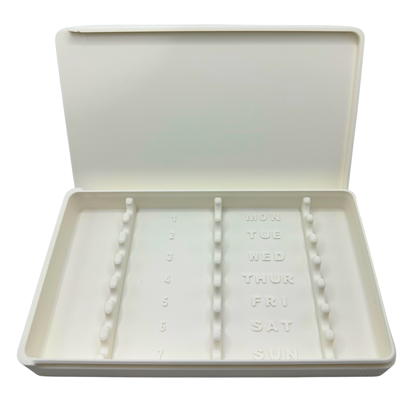 White 7-slot weekly syringe organizer case shown empty to display interior layout. Numbered slots 1 through 7 with day-of-week labels Monday through Sunday and raised dividers. Prefilled syringe storage case with sliding lid designed for 1ml insulin syringes up to 180mm long. Ideal for TRT, GLP-1, HRT, or peptide routines.