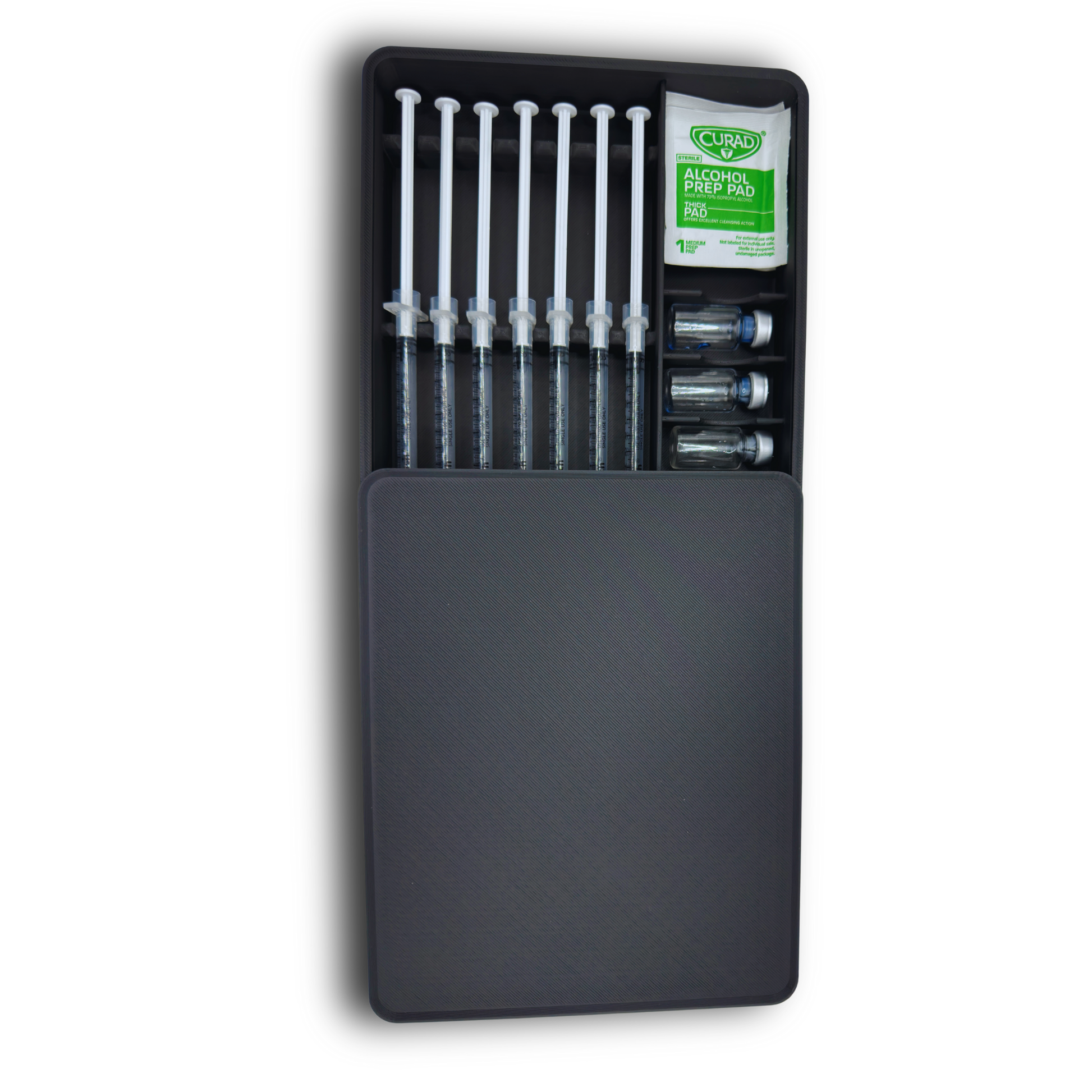 Compact syringe and vial storage case partially covered with protective lid. Holds 7 prefilled 1ml syringes up to 120mm in length, 5 standard 3ml vials, and alcohol wipes. Slim organizer box designed for fridge storage and secure organization of TRT, GLP-1, insulin, peptide, or wellness supplies.