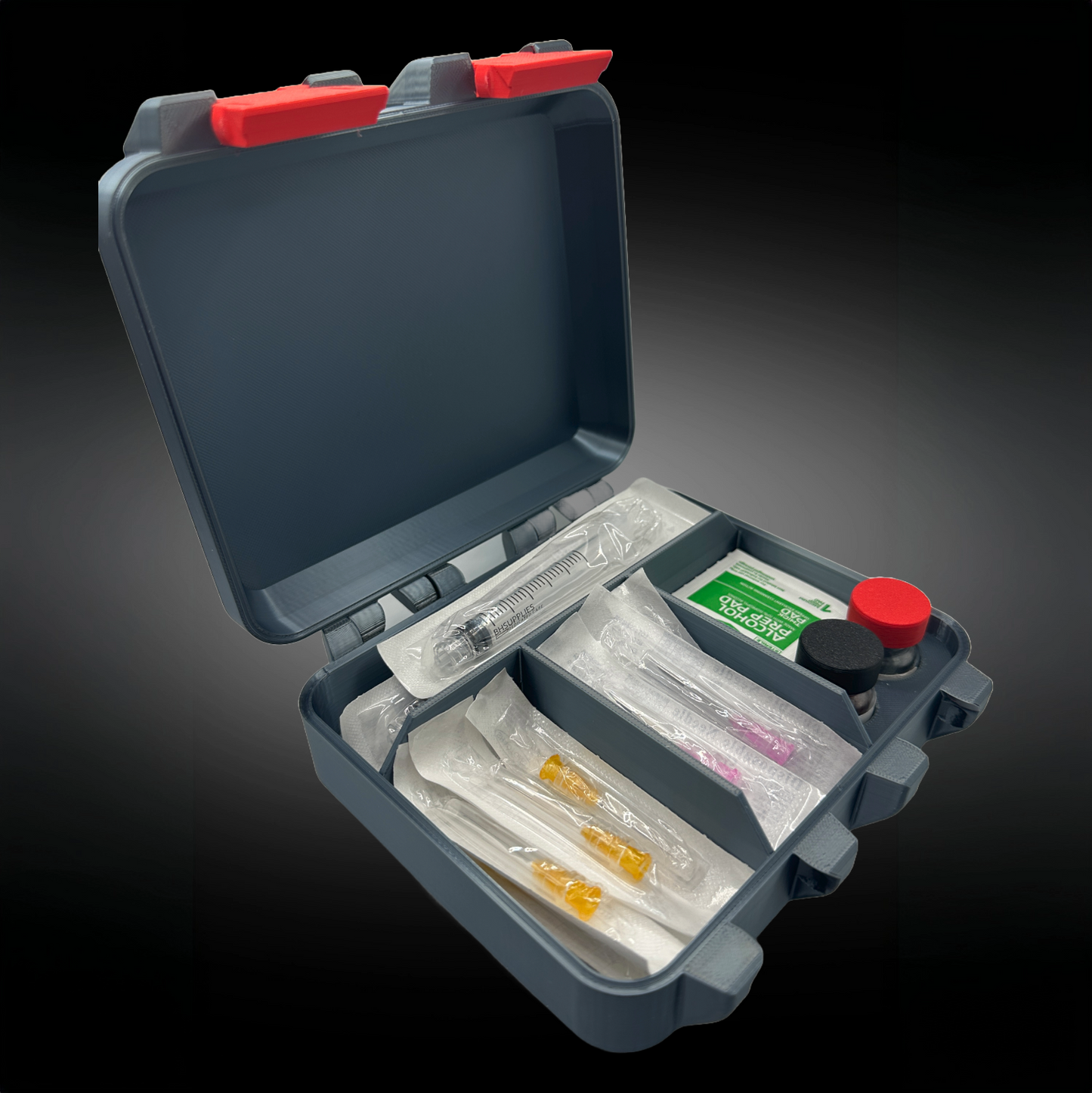 Open hormone therapy storage case with organized compartments holding syringes, alcohol prep pads, needles, and vials with color-coded caps.
